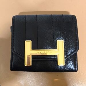 Halston Heritage change purse. Black and gold coloring.